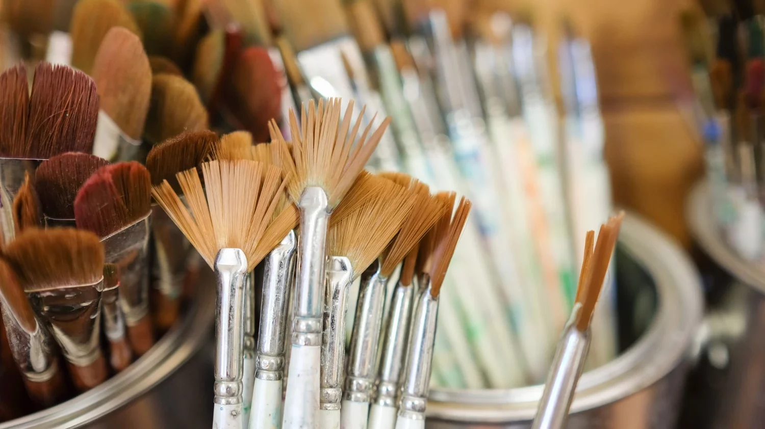 paint brushes in a cup